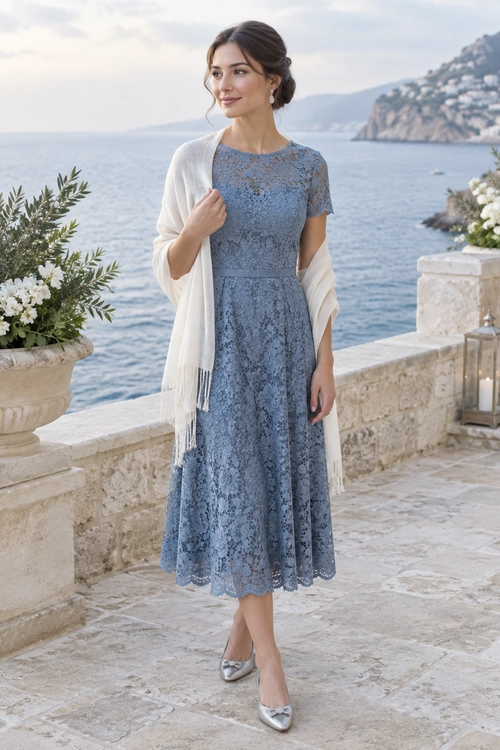 Blue Lace Dress with Cream Shawl A blue-gray lace midi dress is styled with a cream shawl and silver flats.