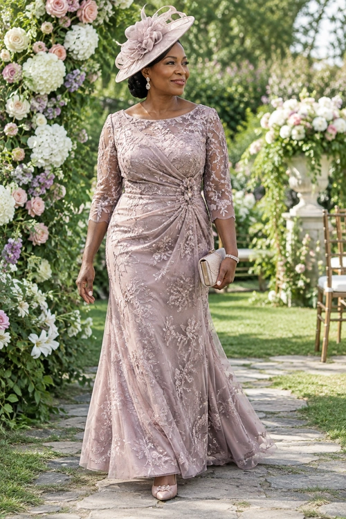 Mauve Lace Occasion Outfit A woman wears a floor-length mauve lace gown with a matching floral hat, a small beige clutch, and matching shoes.