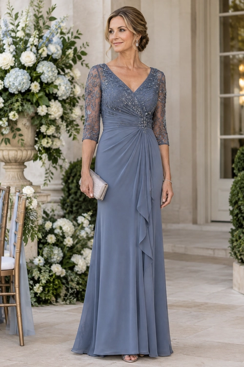 A floor-length slate blue gown with lace three-quarter sleeves and a draped skirt, styled with a beige clutch and drop earrings.